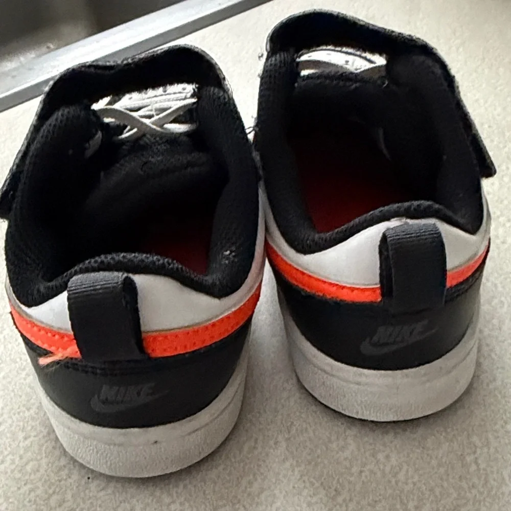 Nike Kids' Sneakers in Black, White, and Orange